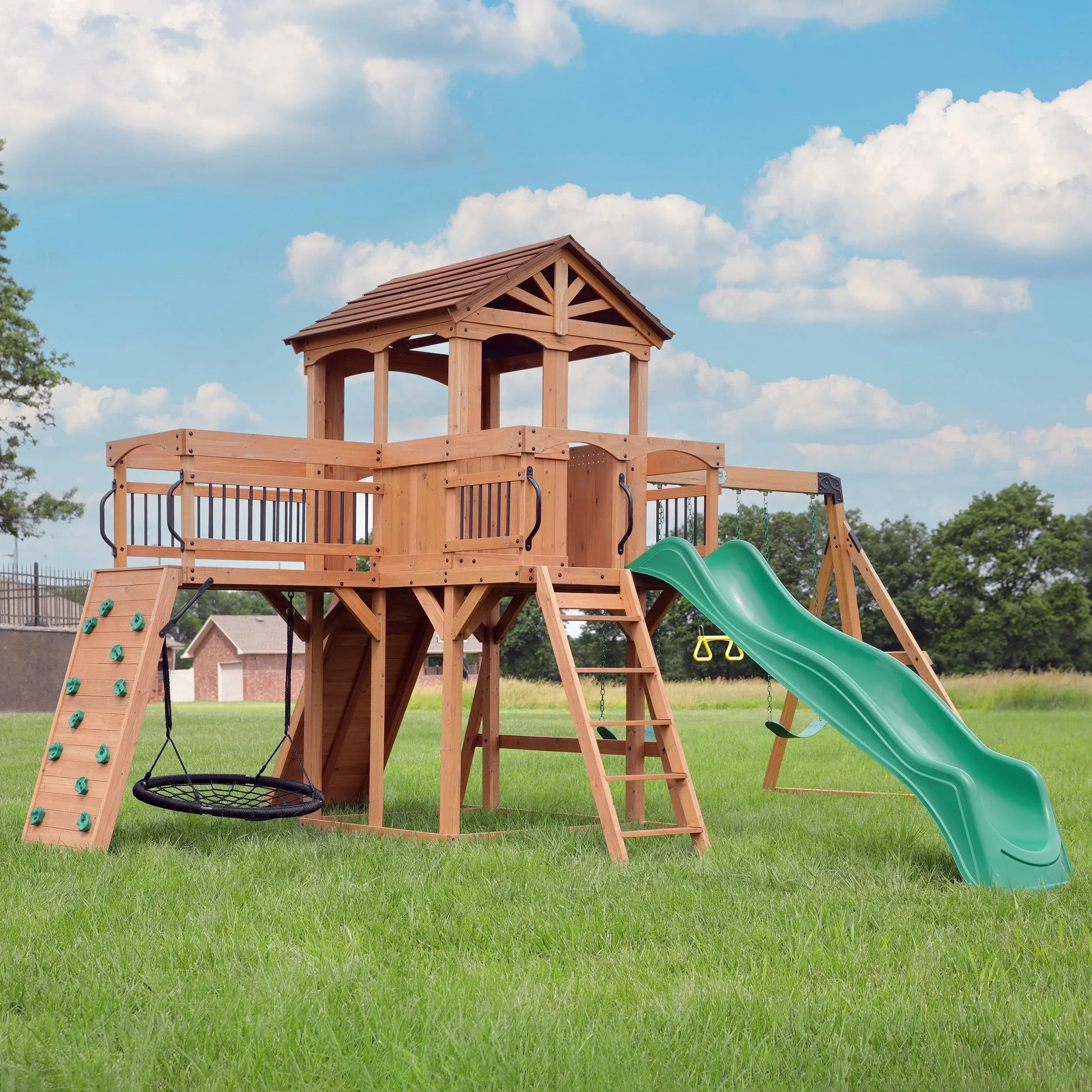 Backyard Discovery Sterling Point All Cedar Wooden Swing Set, Raised Clubhouse,Web Swing, Climbing Wall, 10ft Wave Slide, 2 Belt Swings, Front Porch, Bridge